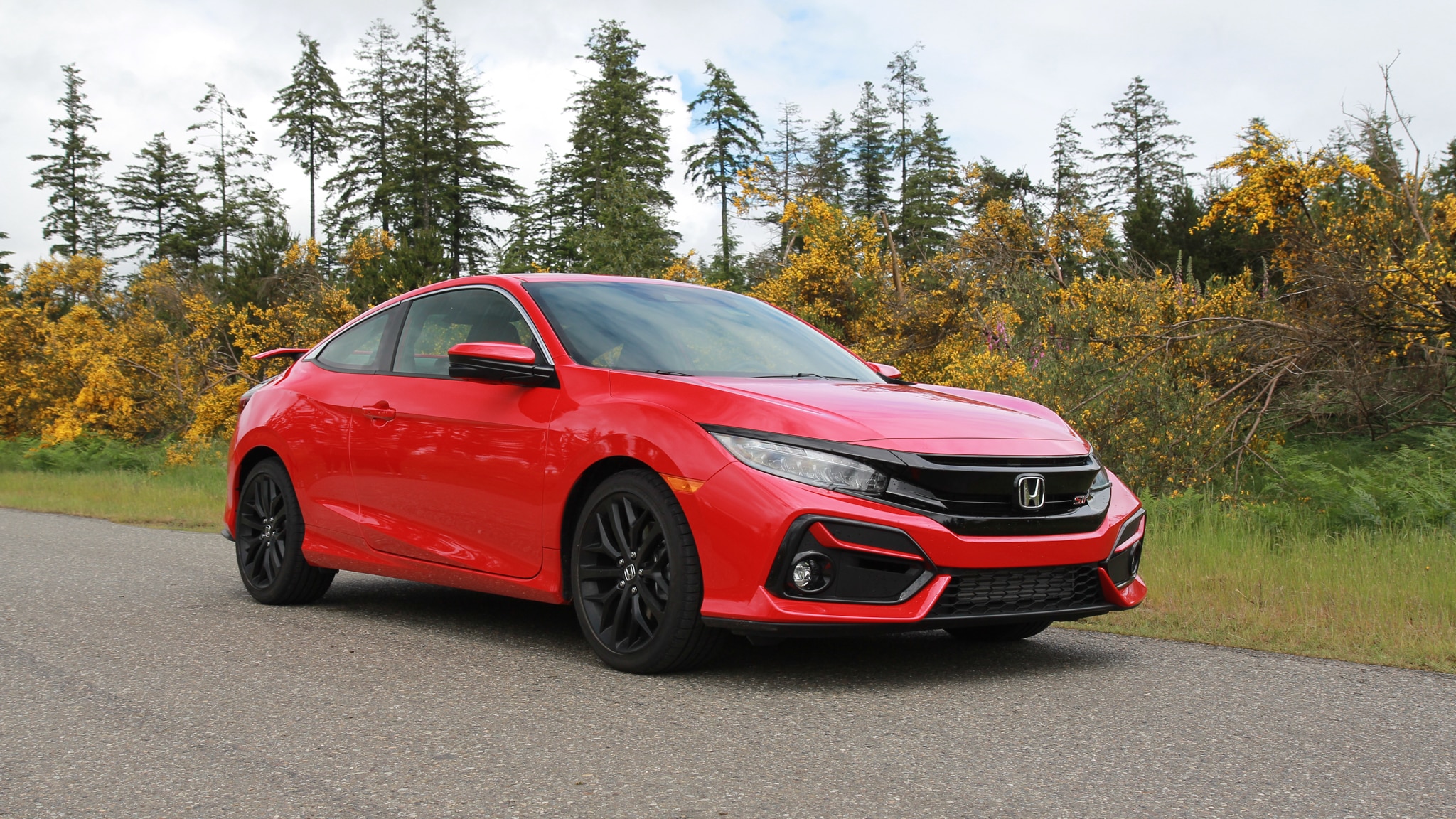 2020 Honda Civic Si Coupe driving on a road